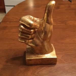 Gold thumbs up statue
